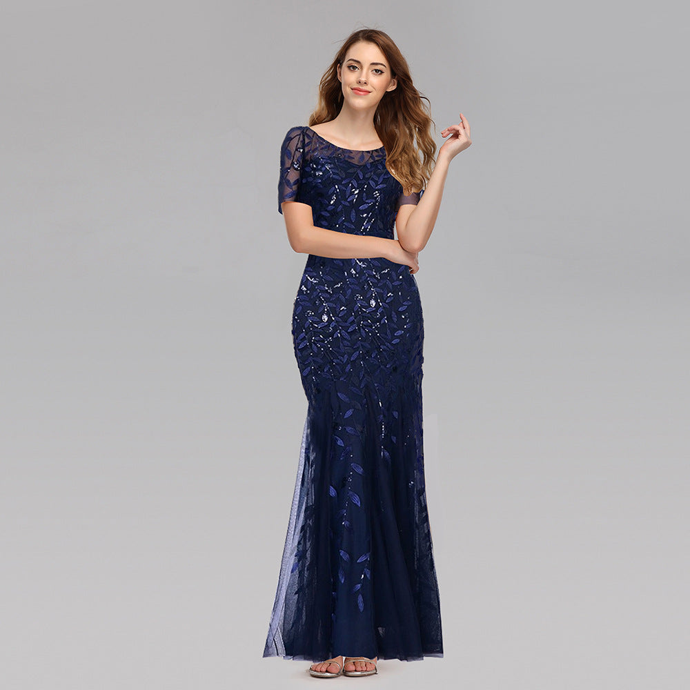 Plus size Maryangel Rebel evening dress featuring sequin mesh, fishtail design, and a slim fit for a sexy look.