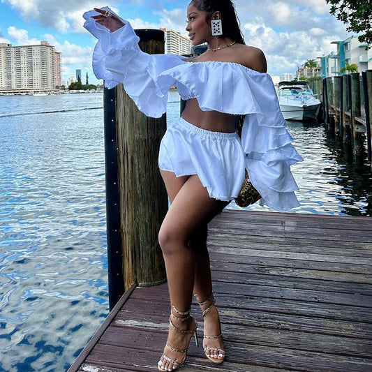 Spring solid color ruffled two-piece set featuring a sexy top and pleated skirt by Maryangel Rebel.