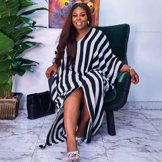 Plus size women’s striped asymmetric dress by Maryangel Rebel, featuring a loose fit and stylish irregular design.