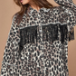 Maryangel Rebel leopard print denim jacket with distressed details and tassels, showcased in a stylish, casual setting.