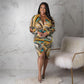 Plus size V-neck floral print dress with slit, pleated design, and hollow cutout sleeves by Maryangel Rebel.
