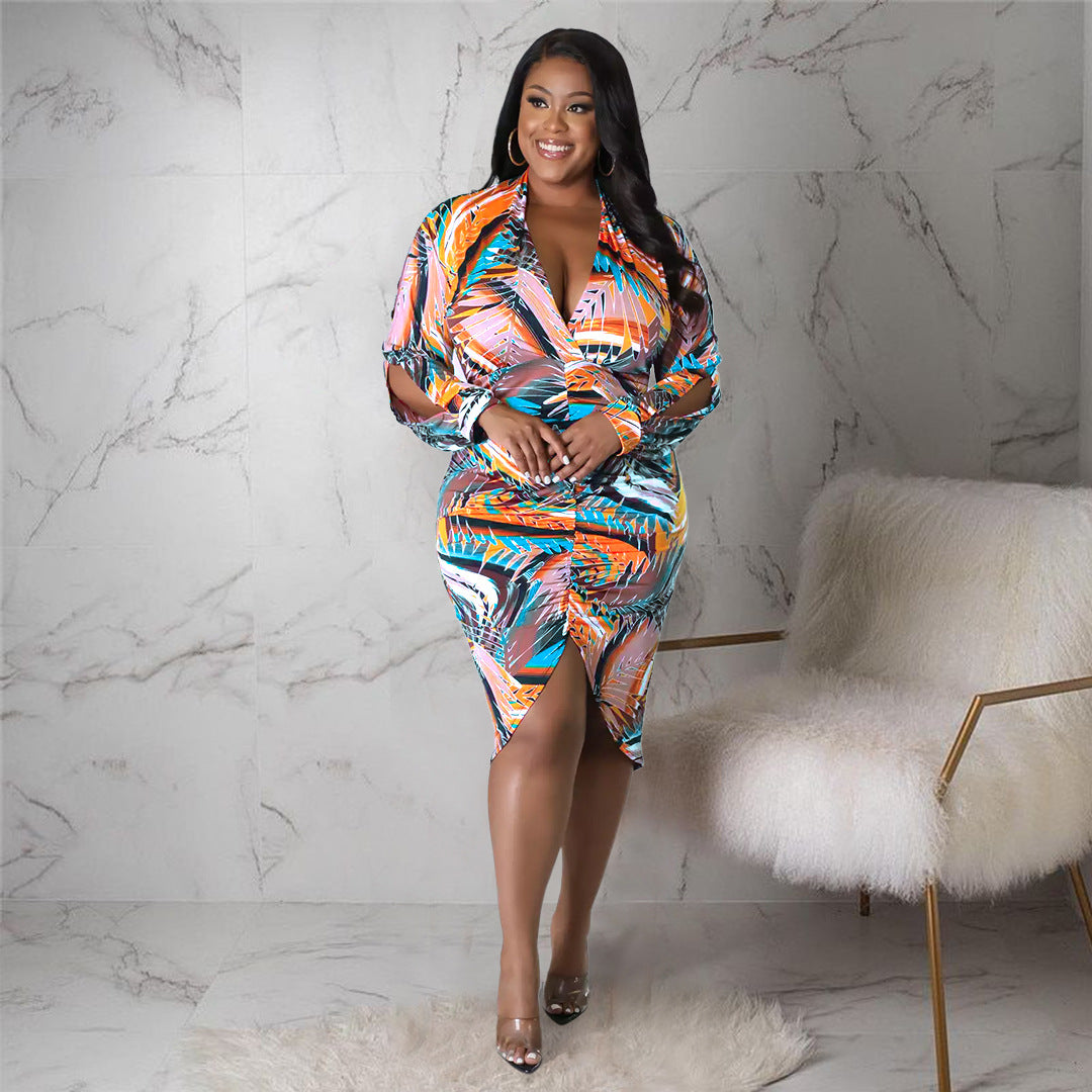 Plus size V-neck floral print dress with slit, pleated design, and hollow cutout sleeves by Maryangel Rebel.