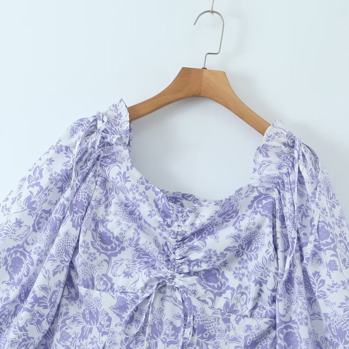 Large Maryangel Rebel swing dress featuring a spring floral pattern and a flattering waist seal design.