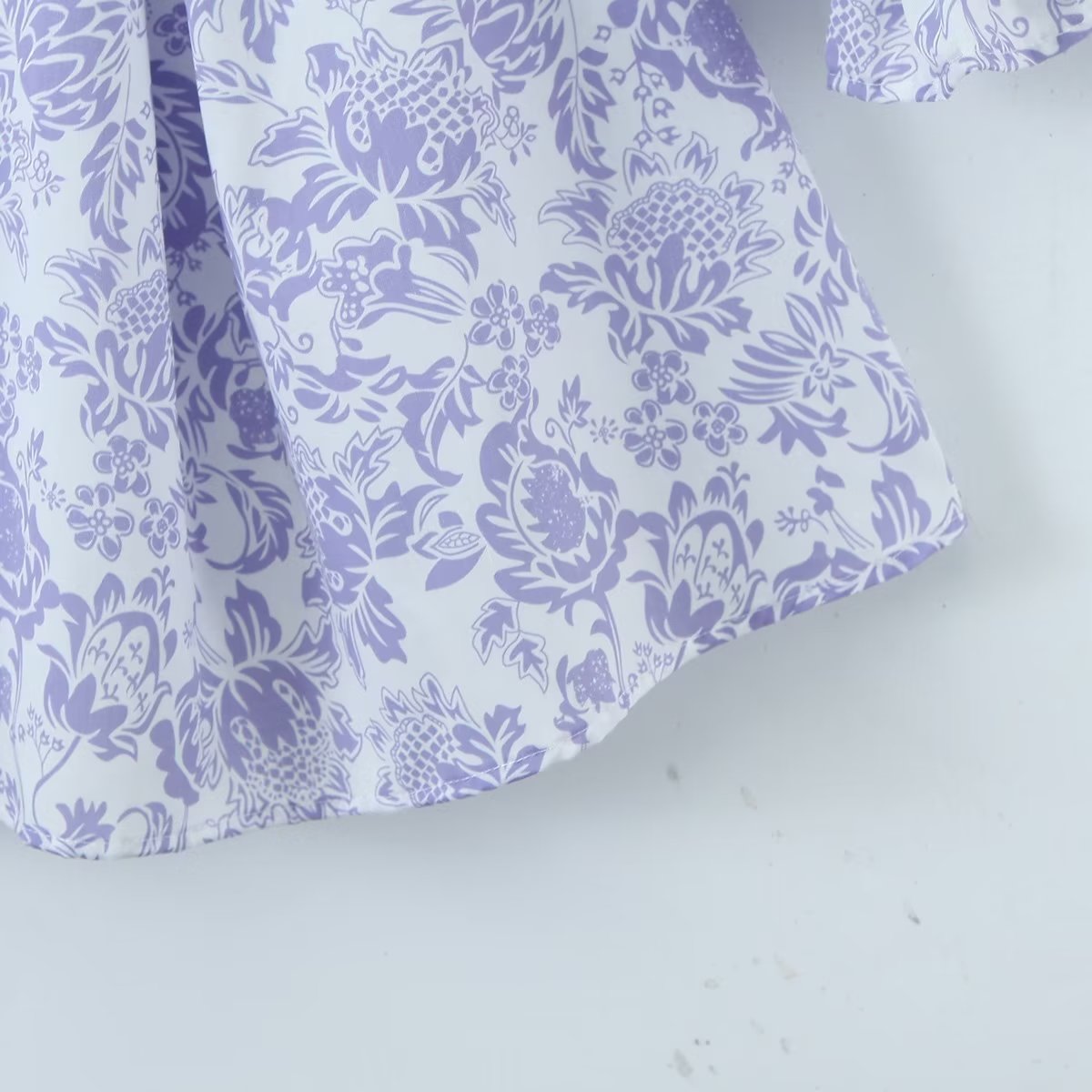 Maryangel Rebel large swing dress featuring a spring floral design and waist seal, displayed on a mannequin.