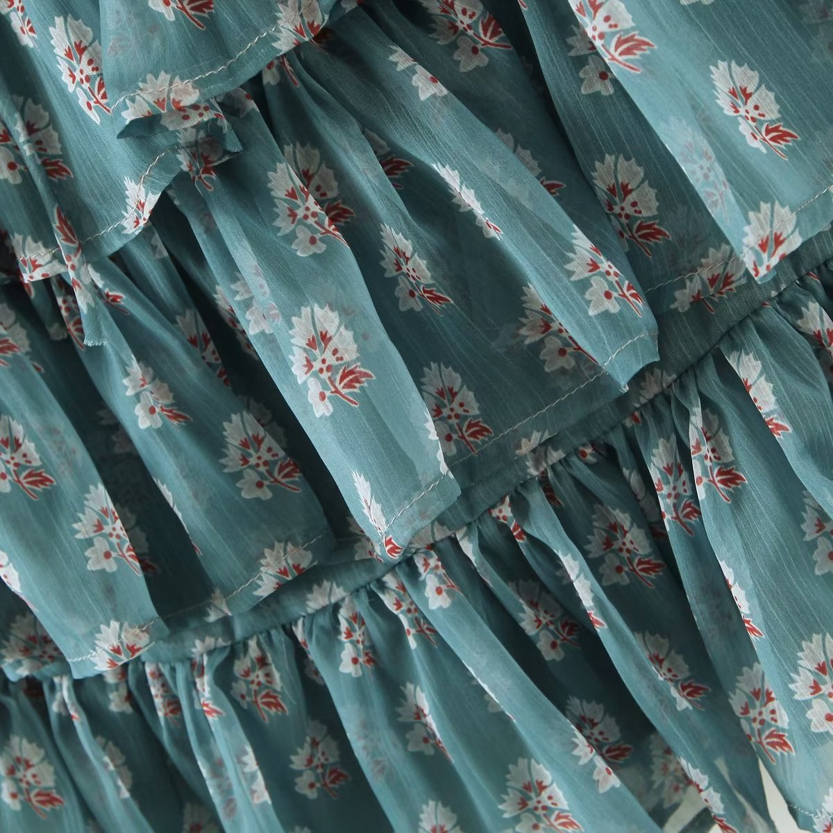 Elegant Maryangel Rebel floral chiffon dress with slim fit, square collar, and puff sleeves in a tiered design.