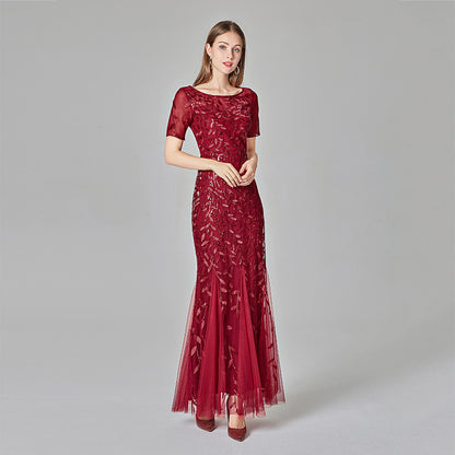 Plus size Maryangel Rebel evening dress featuring sequin mesh and a fishtail design, showcasing a slim fit and sexy style.