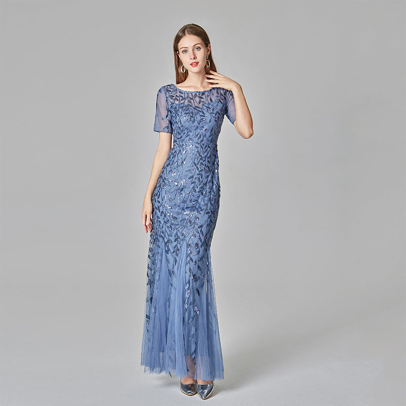 Plus size Maryangel Rebel evening dress featuring sequin mesh and a fishtail design, perfect for a sexy, slim fit look.
