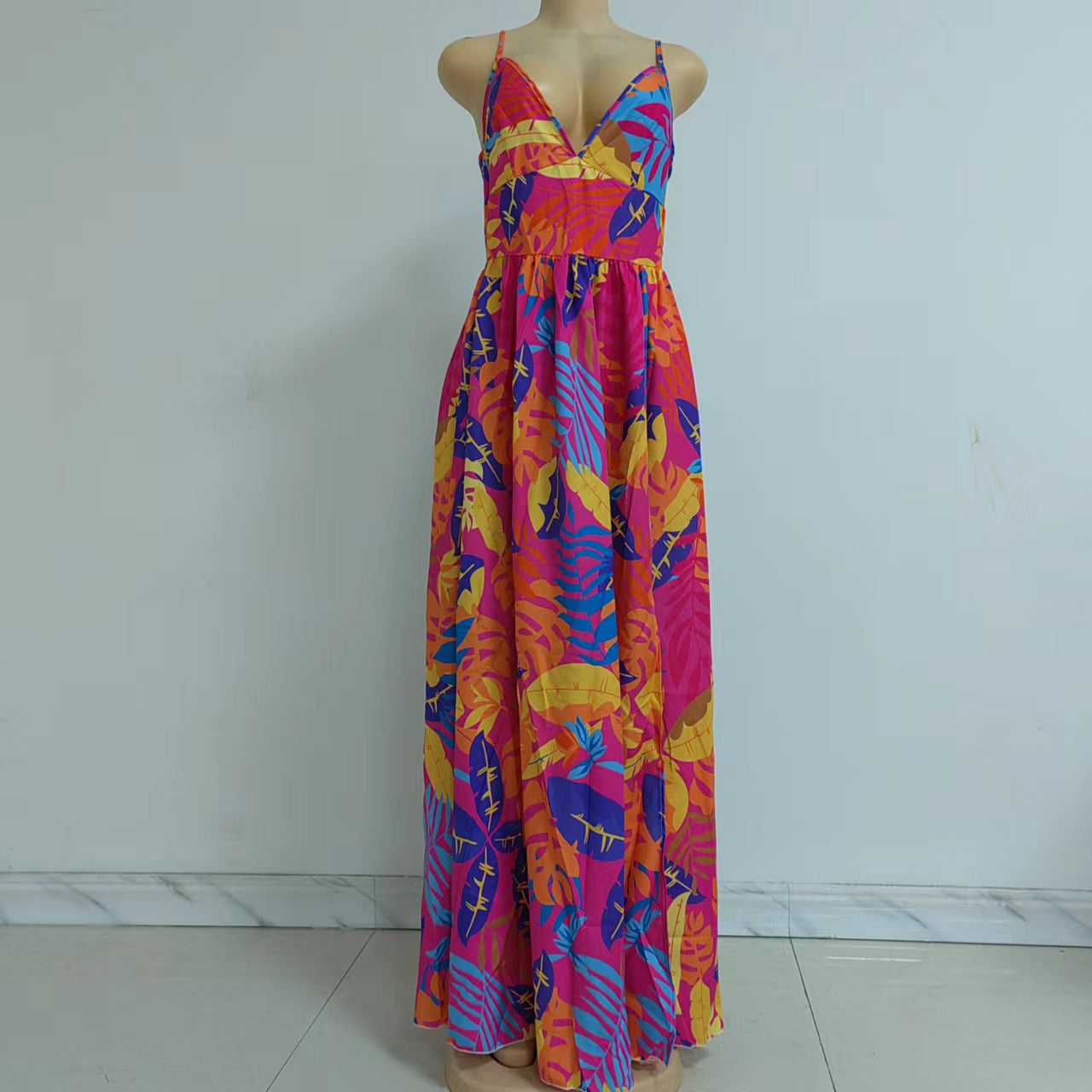 Maryangel Rebel bohemian off-the-shoulder maxi dress with a leafy print and four-sided stretch design.