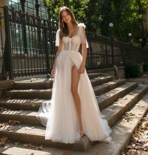 Maryangel Rebel women's wedding dress featuring a sexy sling backless design with see-through fabric and a thigh-high split.
