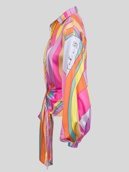 Plus size loose long sleeve printed shirt top by Maryangel Rebel in a vibrant floral pattern.