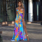 Bohemian off-the-shoulder maxi dress by Maryangel Rebel featuring a colorful leaf pattern and four-sided stretch design.