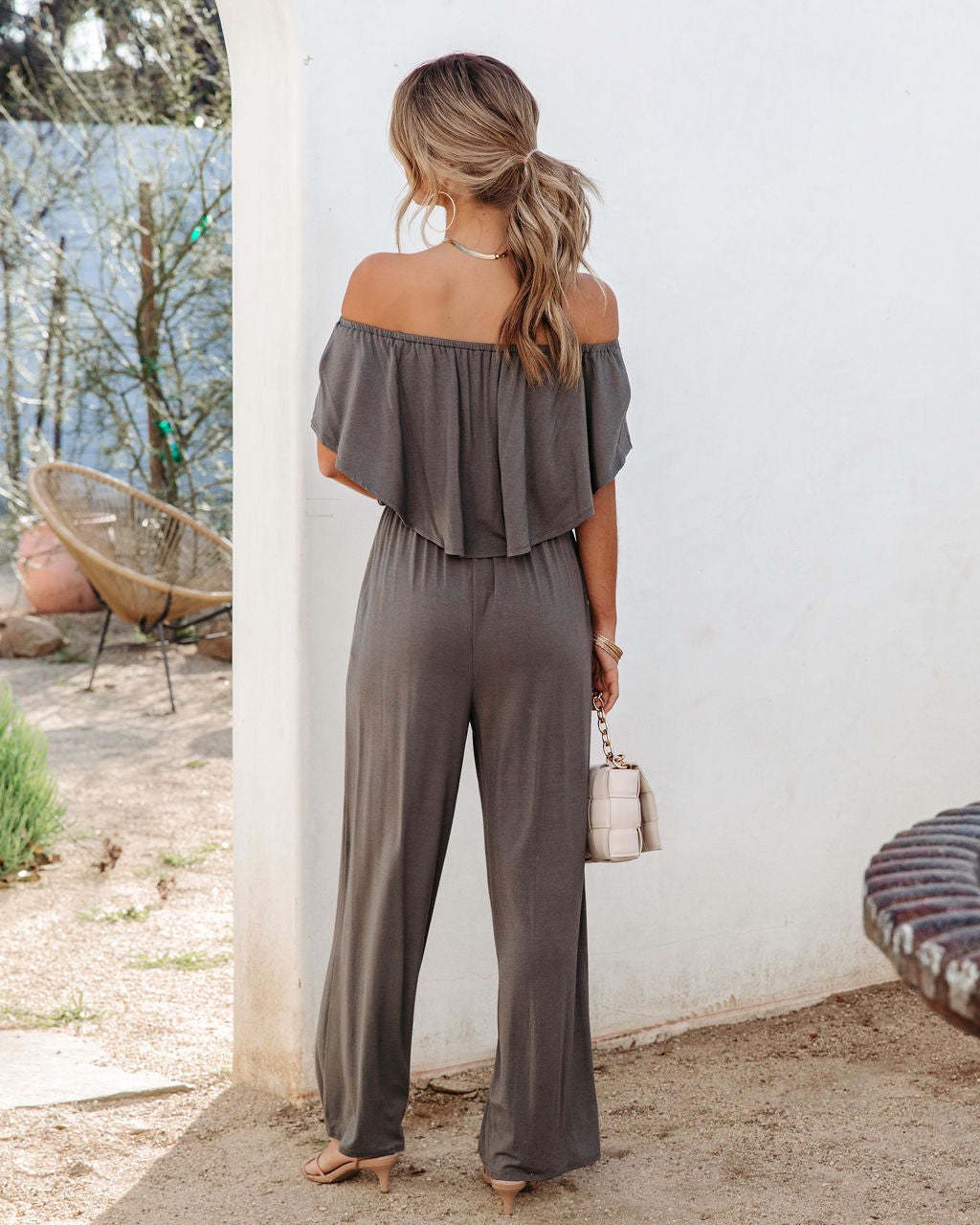Off-shoulder elegant jumpsuit for women by Maryangel Rebel, featuring a stylish shoulder-baring design for spring and summer.