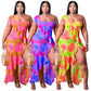 Plus size summer dress by Maryangel Rebel featuring a single sleeve, asymmetric print, and flounced skirt edge.