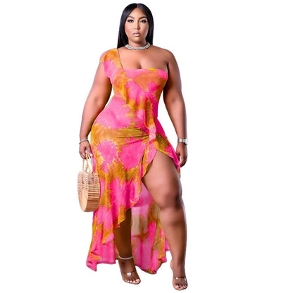 Plus size summer dress by Maryangel Rebel with single sleeve and asymmetric flounced skirt in a vibrant print.