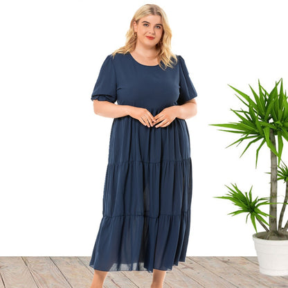 Plus size summer round neck short sleeve dress in a bohemian style by Maryangel Rebel, featuring a vibrant print.