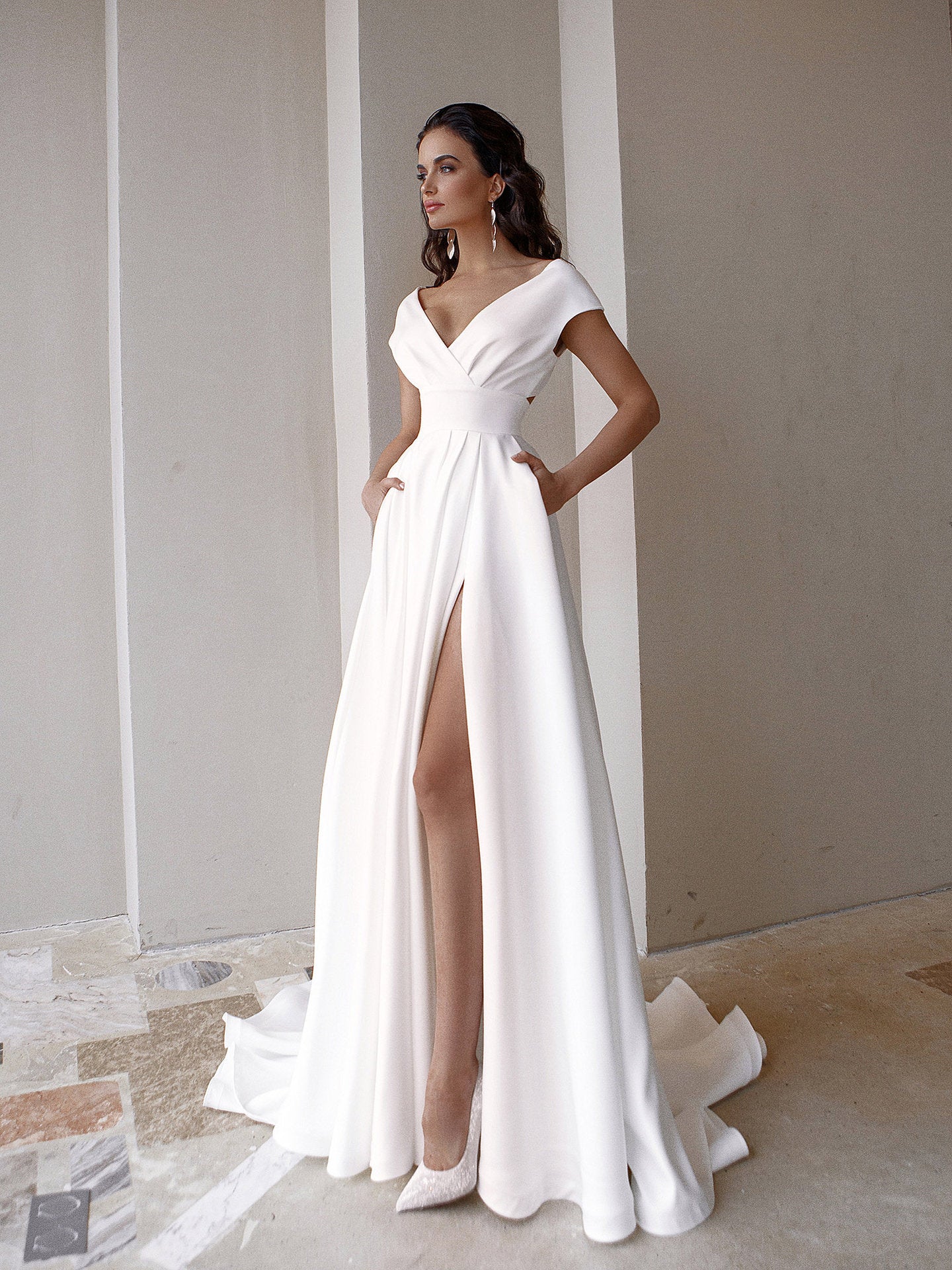 White medium waist maxi dress by Maryangel Rebel with chest wrap and ruffled details, perfect for weddings.