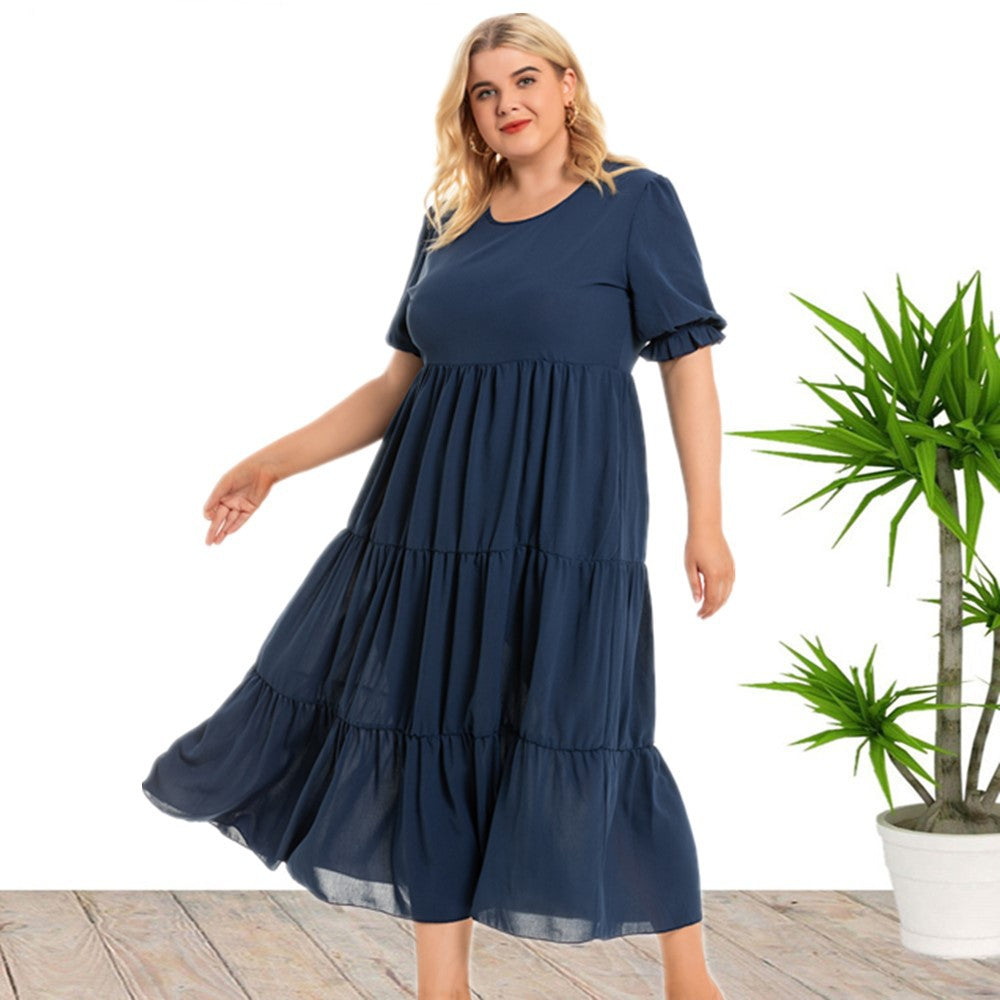 Plus size summer round neck short sleeve bohemian dress by Maryangel Rebel, featuring a vibrant floral pattern.