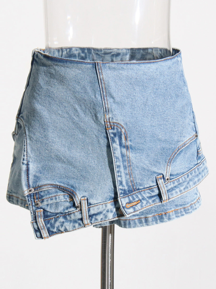 High-waist denim shorts with irregular stitching and a washed look by Maryangel Rebel, showcasing a unique asymmetric design.