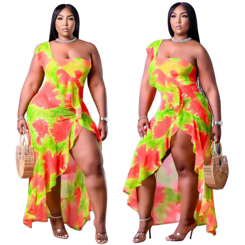 Plus size Maryangel Rebel dress featuring a single sleeve, asymmetric design, and flounced skirt edge in a vibrant print.