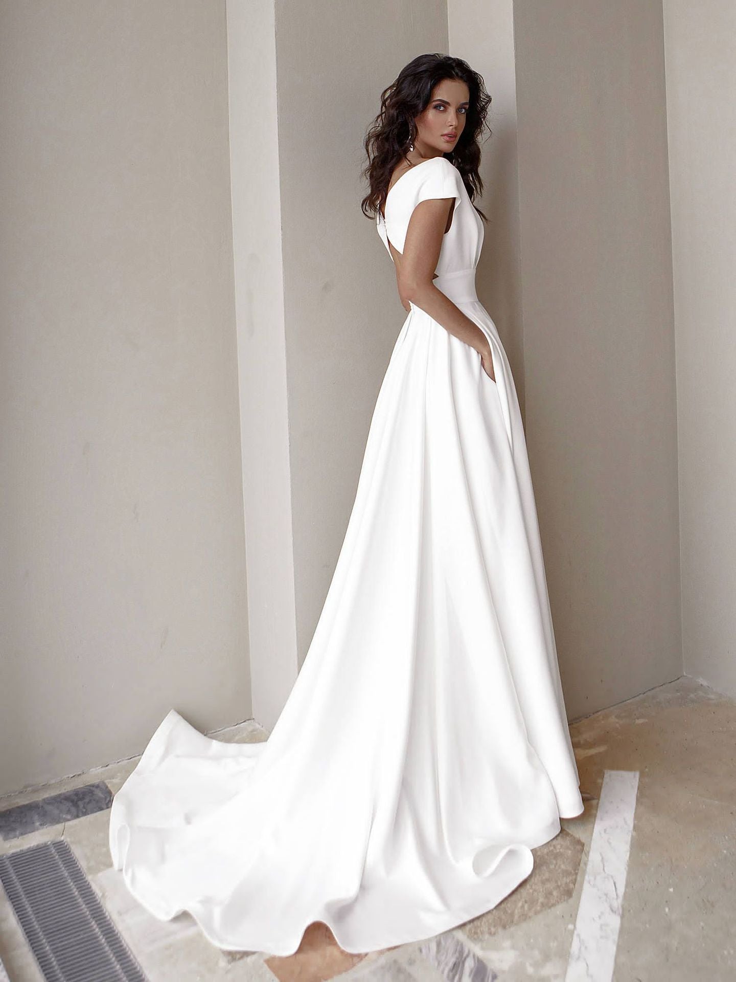 Chest wrapped ruffled white maxi dress with medium waist by Maryangel Rebel, showcasing elegant wedding attire.